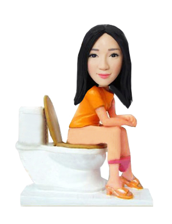 Custom Made Bobble Heads Sitting On The Toilet